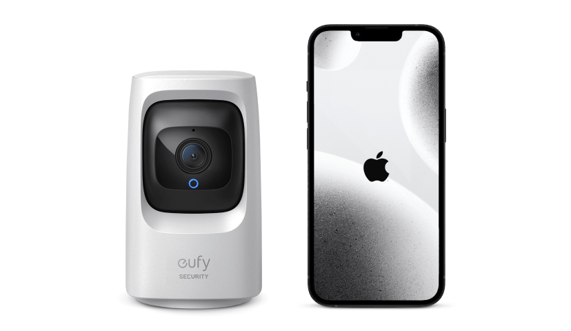 Two gadgets placed on a white background. On the left is a white Eufy Mini Indoor WiFi Pan & Tilt Security Camera. On the right is an Apple iPhone with an abstract grey wallpaper and the Apple logo placed in the center.