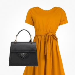 An orange dress next to a black leather handbag, linking to fashion.