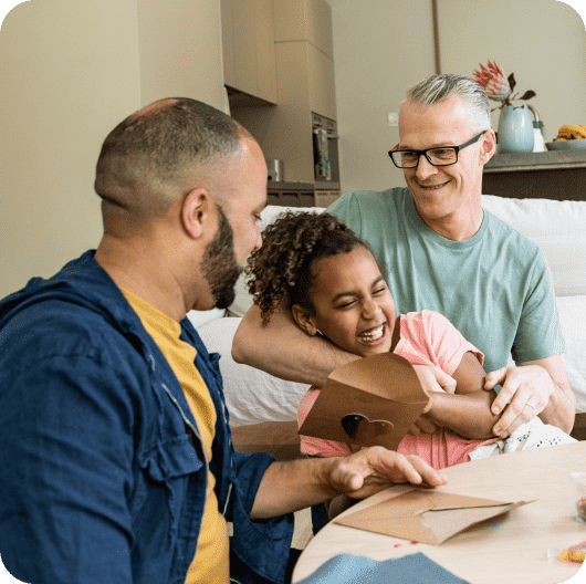 Dads with their daughter linking to pride fashion