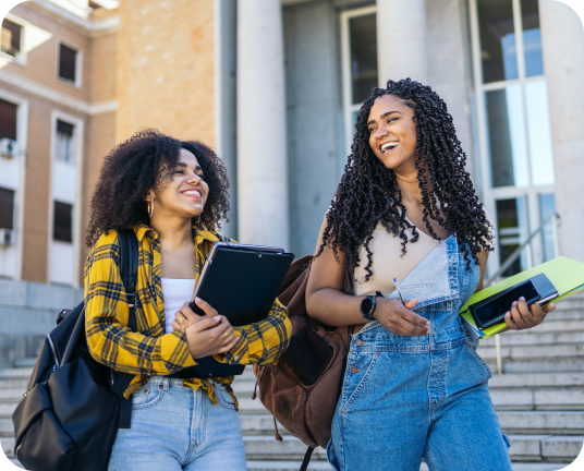 Two people holding notebooks linking to streetwear fashion page.