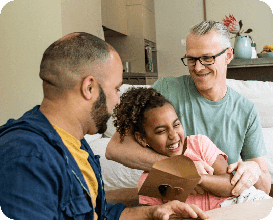Dads with their daughter linking to pride fashion