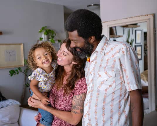 A man and woman holding a child linking to an eBay Inc article