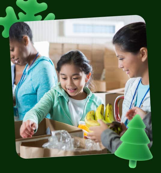 A girl reaching into a box surrounded by other people linking to eBay for Charity shop page
