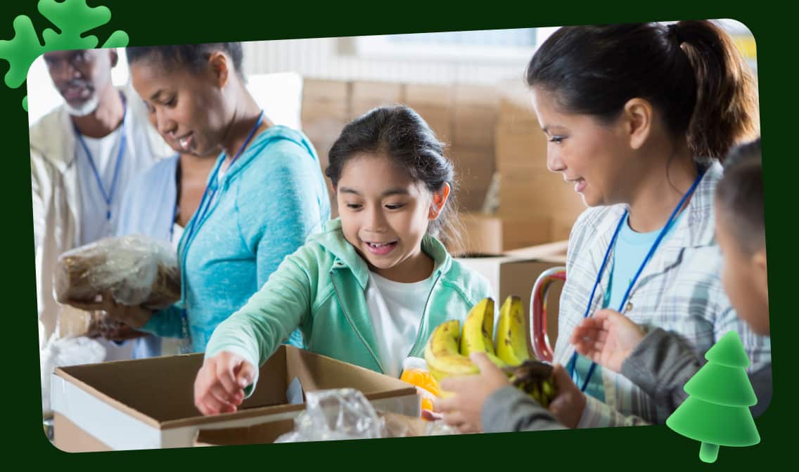 A girl reaching into a box surrounded by other people linking to eBay for Charity shop page