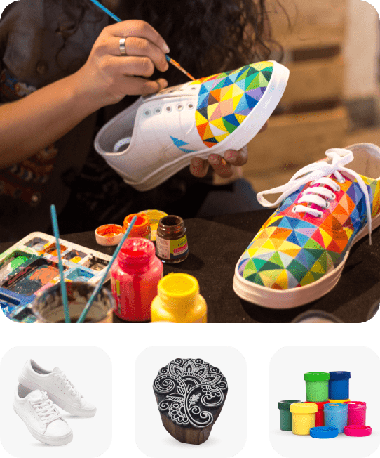 A person painting white shoes linking to DIY landing page, A pair of white shoes, A wooden stamp, Many colors of fabric paint