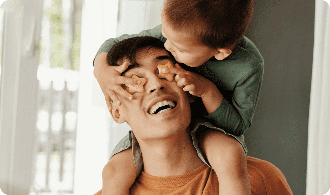 Son on dad's shoulders linking to Father's Day gifts