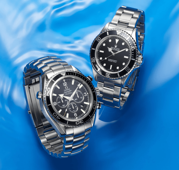 A Rolex Submariner and an OMEGA Seamaster on a blue background.