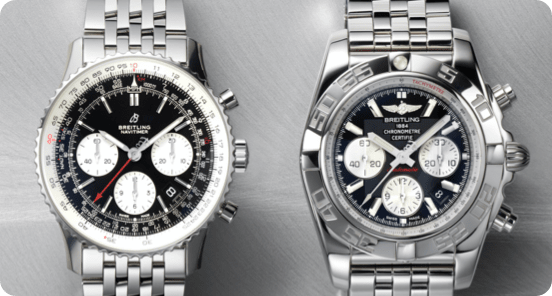 Two silver Breitling watches on a silver background.